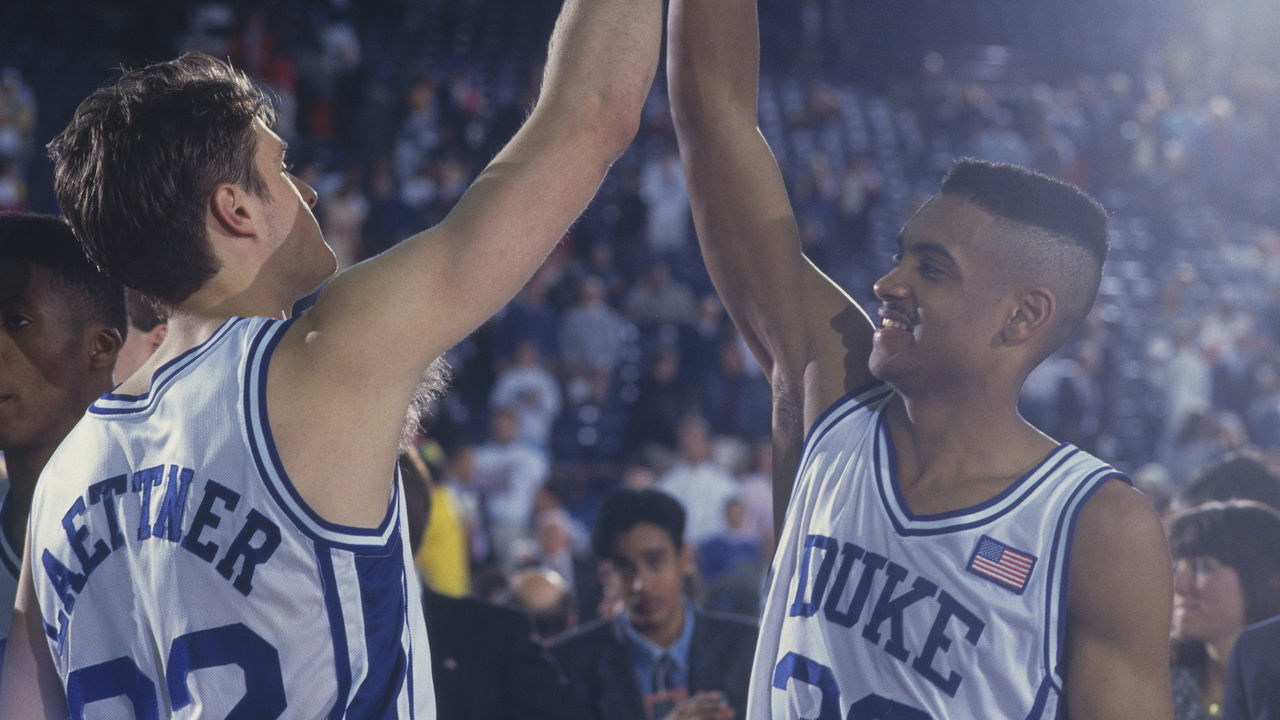 1991: Duke players Grant Hill and Christian Laettner high-five each other in celebration during the NCAA Championship against Kansas in 1991. Duke defeated Kansas 72-65.