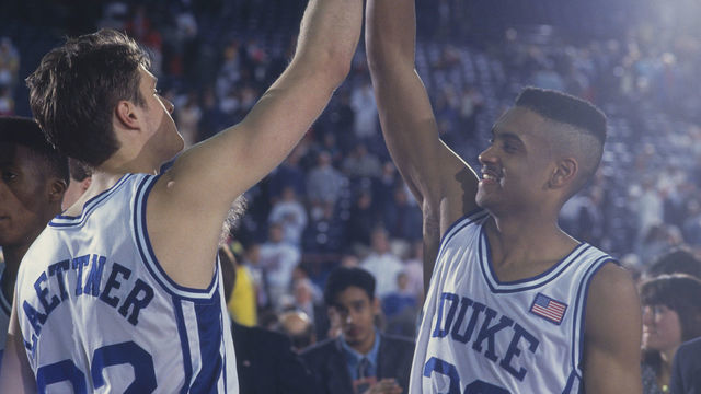 1991: Duke players Grant Hill and Christian Laettner high-five each other in celebration during the NCAA Championship against Kansas in 1991. Duke defeated Kansas 72-65.