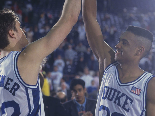 1991: Duke players Grant Hill and Christian Laettner high-five each other in celebration during the NCAA Championship against Kansas in 1991. Duke defeated Kansas 72-65.