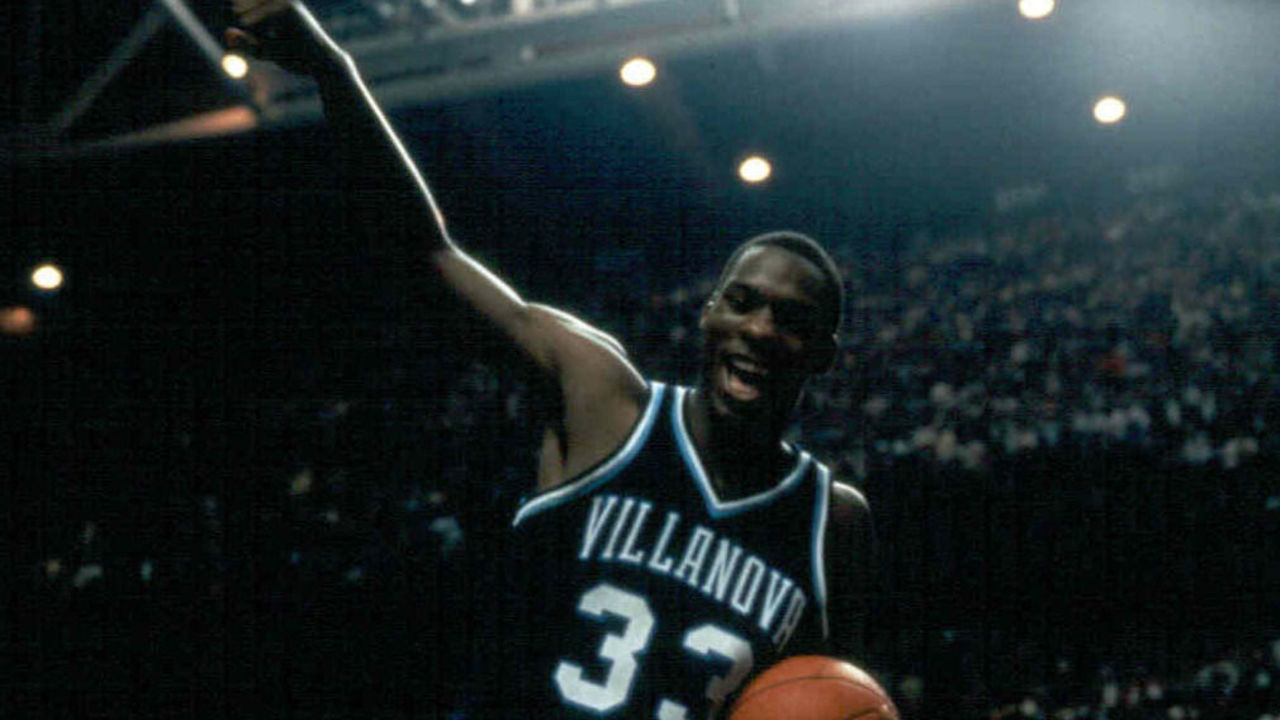 LEXINGTON, KY - APRIL 1, 1985: Dwayne McClain, #33 guard of the Villamova University Wildcats men's basketball team celebrates after making a play against the Georgetown University Hoyas during the 1985 NCAA Men's Basketball Championship game on April 1, 1985 at Rupp Arena in Lexington, Kentucky. The Wildcats won 66-64