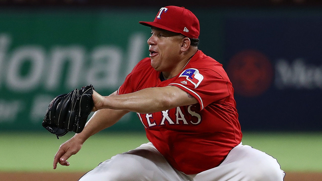 ARLINGTON, TX - AUGUST 07: Bartolo Colon #40 of the Texas Rangers makes the catch for the final out of the sixth inning against Dee Gordon #9 of the Seattle Mariners at Globe Life Park in Arlington on August 7, 2018 in Arlington, Texas.