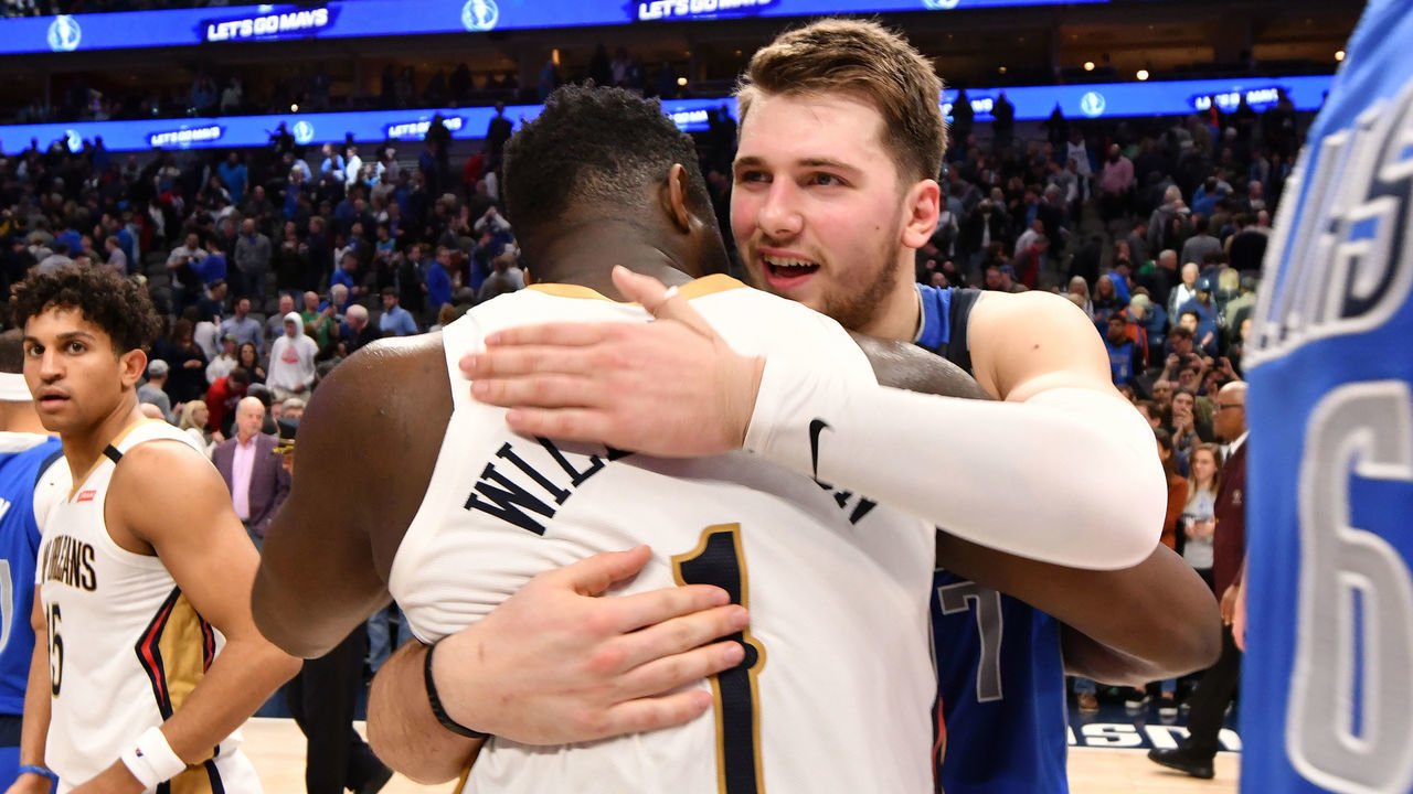 DALLAS, TX - MARCH 4: Zion Williamson #1 of the New Orleans Pelicans hugs Luka Doncic #77 of the Dallas Mavericks after the game on March 4, 2020 at the American Airlines Center in Dallas, Texas. Mandatory Copyright Notice: Copyright 2020 NBAE