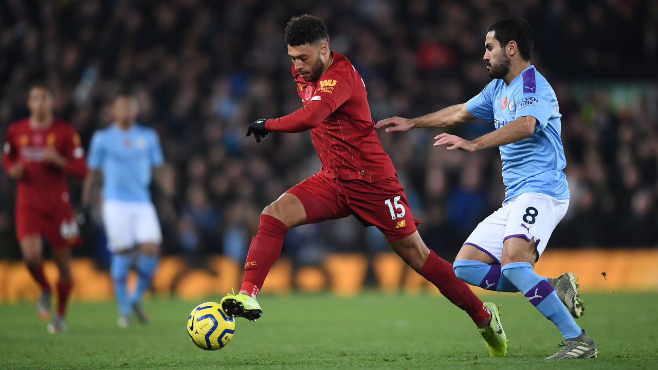 LIVERPOOL, ENGLAND - NOVEMBER 10: Alex Oxlade-Chamberlain of Liverpool battles for possession with Ilkay Gundogan of Manchester City during the Premier League match between Liverpool FC and Manchester City at Anfield on November 10, 2019 in Liverpool, United Kingdom.