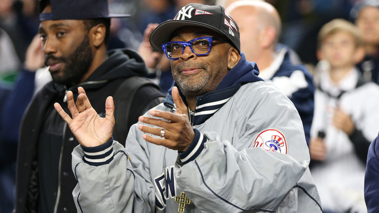 NEW YORK, NY - OCTOBER 17: Spike Lee cheers in the stands during Game 4 of the American League Championship Series between the New York Yankees and the Houston Astros at Yankee Stadium on Tuesday, October 17, 2017 in the Bronx borough of New York City.
