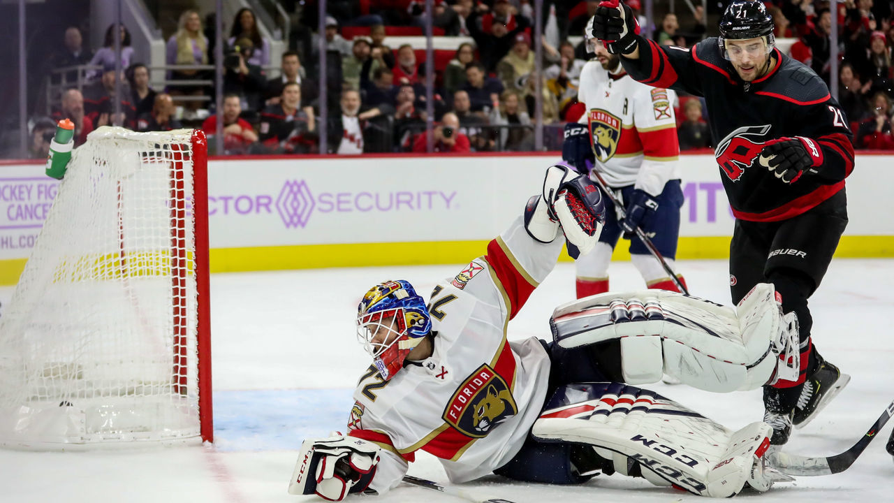 RALEIGH, NC - NOVEMBER 23: Florida Panthers Goalie Sergei Bobrovsky (72) watches the puck go in the net behind him as Carolina Hurricanes Left Wing Nino Niederreiter (21) celebrates the goal during an NHL game between the Florida Panthers and the Carolina Hurricanes on November 23, 2019 at the PNC Arena in Raleigh, NC.