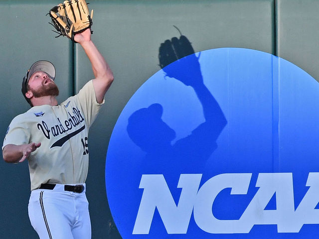 OMAHA, NE - JUNE 26: Stephen Scott #19 of the Vanderbilt Commodores catches a fly ball at the ball in the fifth inning against the Michigan Wolverines during game three of the College World Series Championship Series on June 26, 2019 at TD Ameritrade Park Omaha in Omaha, Nebraska.