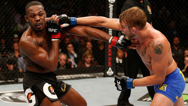 TORONTO, CANADA - SEPTEMBER 21: (R-L) Alexander 'The Mauler' Gustafsson punches Jon 'Bones' Jones in their UFC light heavyweight championship bout at the Air Canada Center on September 21, 2013 in Toronto, Ontario, Canada.