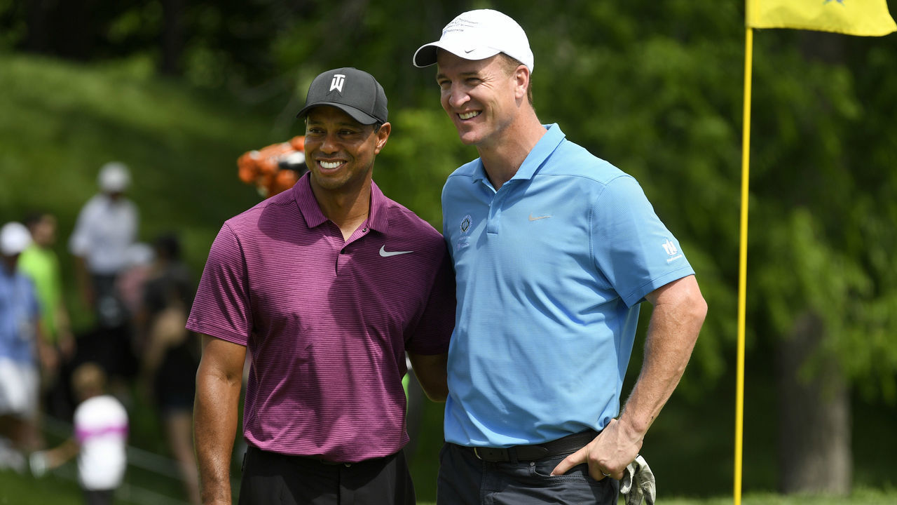 DUBLIN, OHIO - MAY 30: Tiger Woods and Peyton Manning pose for a photo on the 18th green after their Pro-Am round prior to the Memorial Tournament presented by Nationwide at Muirfield Village Golf Club on May 30, 2018 in Dublin, Ohio.