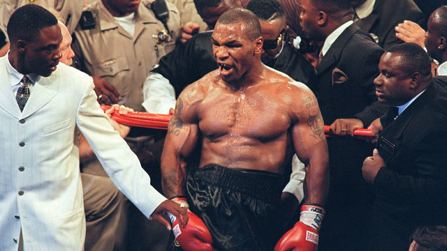 Mike Tyson reacts after being disqualified at the end of the third round of his fight with WBA heavyweight champion Evander Holyfield in the MGM Grand Garden Arena 28 June 1997. Holyfield won by disqualification after being bitten by Tyson. AFP PHOTO/JOHN GURZINSKY