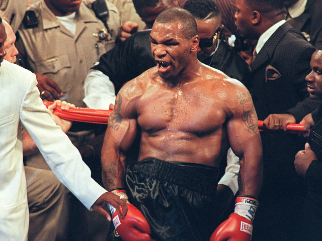 Mike Tyson reacts after being disqualified at the end of the third round of his fight with WBA heavyweight champion Evander Holyfield in the MGM Grand Garden Arena 28 June 1997. Holyfield won by disqualification after being bitten by Tyson. AFP PHOTO/JOHN GURZINSKY