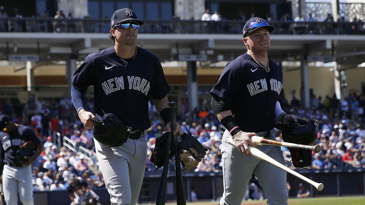 VARIOUS CITIES, - MARCH 12: Tyler Wade #14 and Clint Frazier #77 of the New York Yankees head to the clubhouse against the Washington Nationals at the end of the fifth inning of a Grapefruit League spring training game at FITTEAM Ballpark of The Palm Beaches on March 12, 2020 in West Palm Beach, Florida. Many professional and college sports, including the MLB, are canceling or postponing their games due to the ongoing threat of the Coronavirus (COVID-19) outbreak.