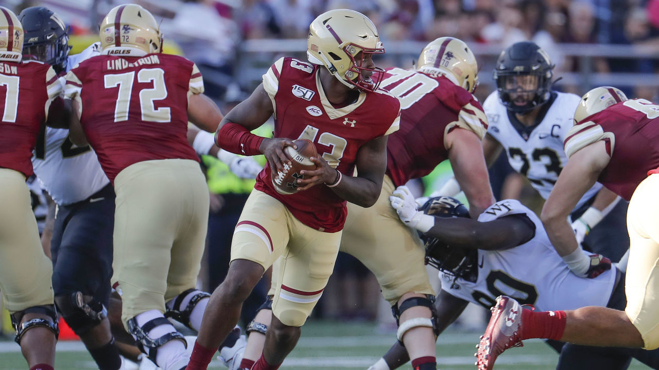 CHESTNUT HILL, MA - SEPTEMBER 28: Boston College quarterback Anthony Brown (13) rolls from the pocket during a game between the Boston College Eagles and the Wake Forest Demon Deacons on September 29, 2019, at Alumni Stadium in Chestnut Hill, Massachusetts.