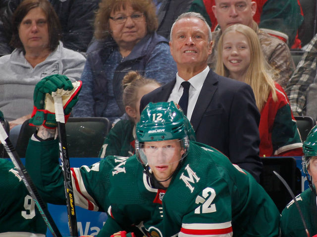 ST PAUL, MINNESOTA - FEBRUARY 15: Interim head coach Dean Evason, Mikko Koivu #9 Eric Staal #12 and Ryan Donato #6 of the Minnesota Wild watch play against the San Jose Sharks from the bench during the first period of the game on February 15, 2020 in St Paul, Minnesota.