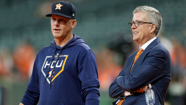 HOUSTON, TEXAS - OCTOBER 05: Manager AJ Hinch #14 talks with Jeff Luhnow, General Manager of the Houston Astros, prior to game two of the American League Division Series against the Tampa Bay Rays at Minute Maid Park on October 05, 2019 in Houston, Texas.