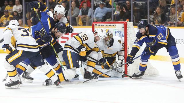 NASHVILLE, TN - FEBRUARY 16: St. Louis Blues left wing Zach Sanford (12) and defenseman Alex Pietrangelo (27) battle for the puck with Nashville Predators right wing Viktor Arvidsson (33), of Sweden, center Ryan Johansen (92), defenseman Roman Josi (59) and goalie Pekka Rinne (35) during the NHL game between the Nashville Predators and St. Louis Blues, held on February 16, 2020, at Bridgestone Arena in Nashville, Tennessee.