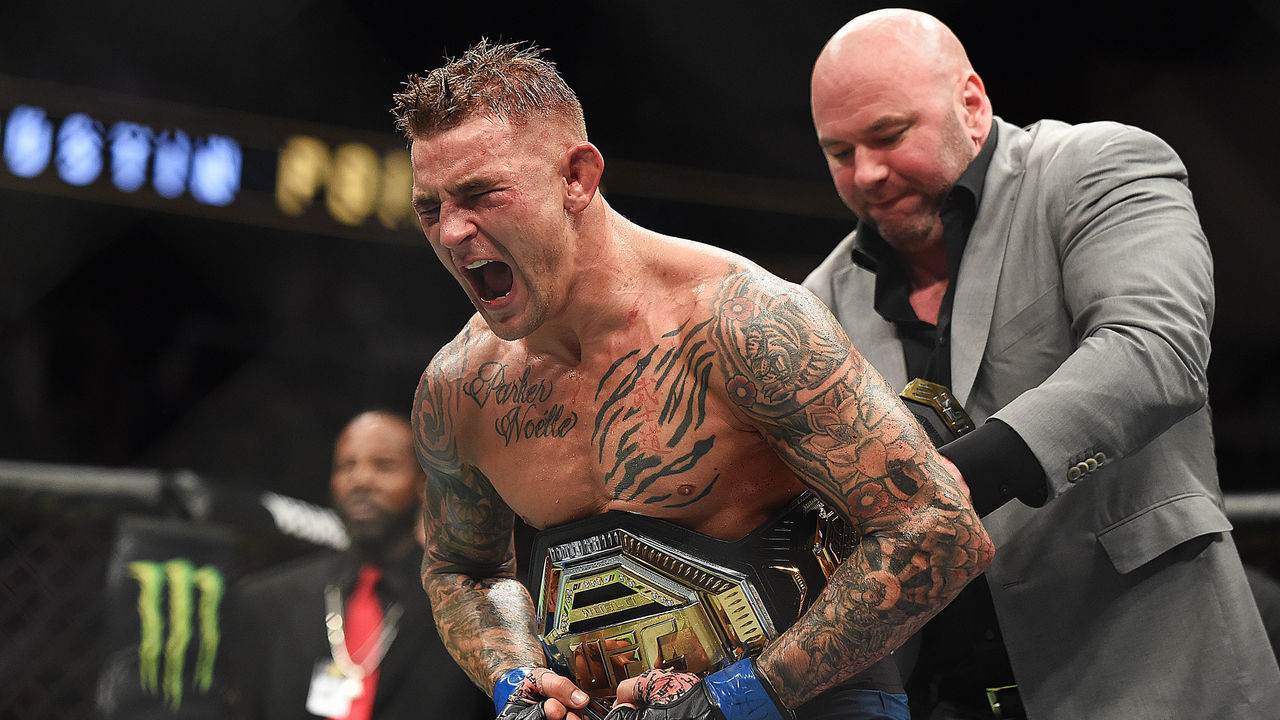 ATLANTA, GEORGIA - APRIL 13: Dustin Poirier celebrates after recieving the title belt from UFC President Dana White during the UFC 236 event at State Farm Arena on April 13, 2019 in Atlanta, Georgia.