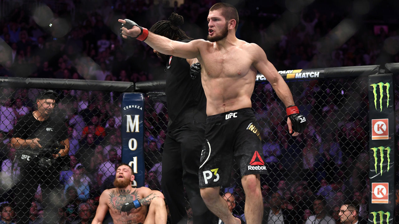 LAS VEGAS, NV - OCTOBER 06: (R-L) Khabib Nurmagomedov of Russia reacts after submitting Conor McGregor of Ireland in their UFC lightweight championship bout during the UFC 229 event inside T-Mobile Arena on October 6, 2018 in Las Vegas, Nevada.