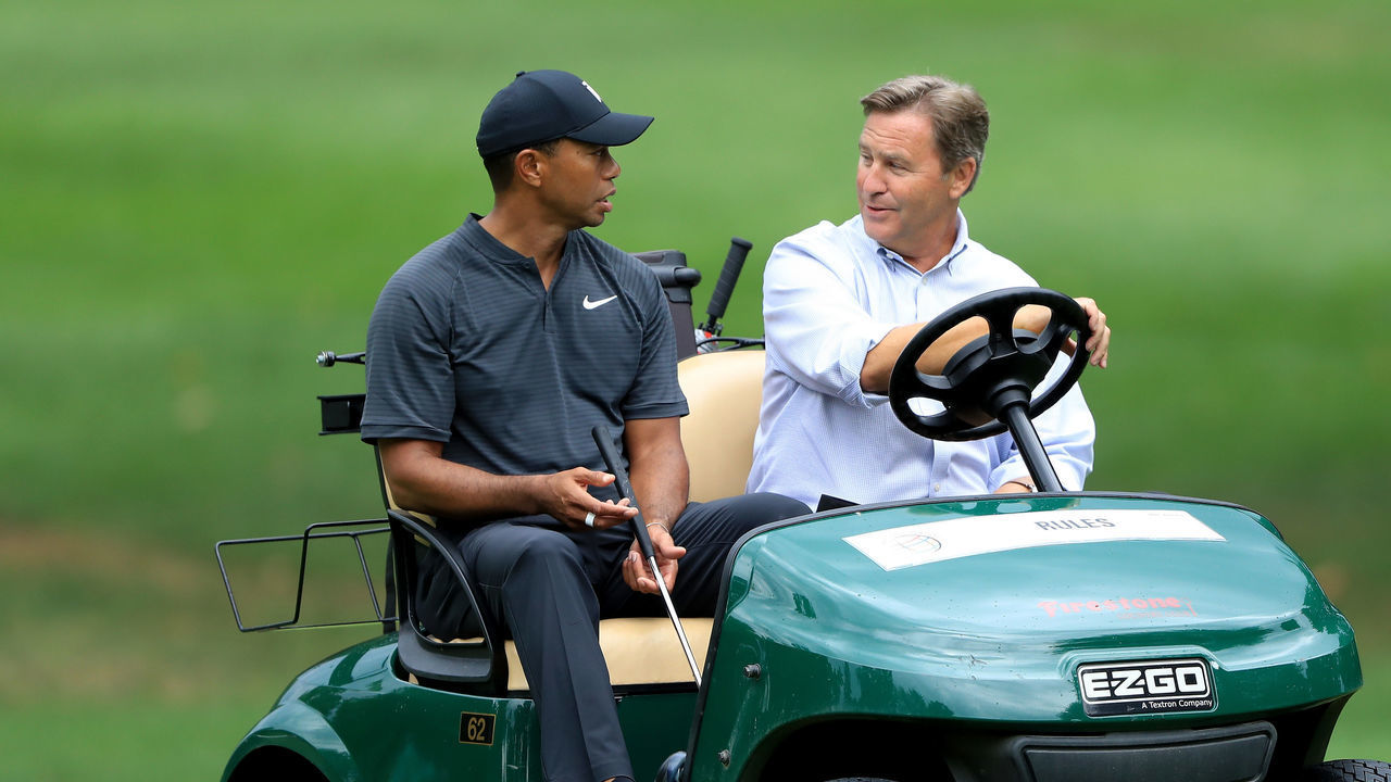 AKRON, OH - AUGUST 01: Tiger Woods (L) meets with Ross Berlin, Senior Vice President of Player Affairs of the PGA Tour, during a preview day of the World Golf Championships - Bridgestone Invitational at Firestone Country Club South Course at on August 1, 2018 in Akron, Ohio.