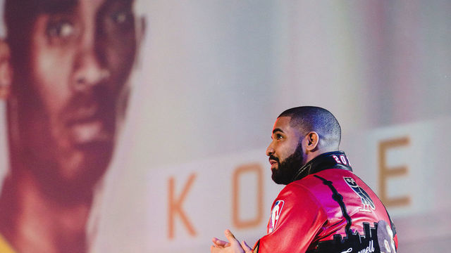 TORONTO, CANADA - FEBRUARY 14: Hip-Hop artist Drake looks on during introductions of Kobe Bryant of the West Team during the NBA All-Star Game as part of the 2016 NBA All-Star Weekend on February 14, 2016 at Air Canada Centre in Toronto, Ontario, Canada. NOTE TO USER: User expressly acknowledges and agrees that, by downloading and/or using this photograph, user is consenting to the terms and conditions of the Getty Images License Agreement. Mandatory Copyright Notice: Copyright 2016 NBAE