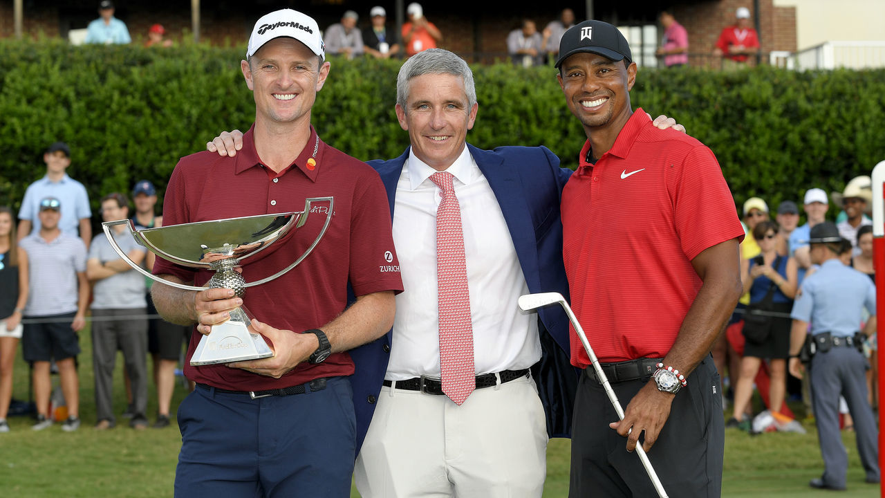 ATLANTA, GA - SEPTEMBER 23: PGA TOUR Commissioner Jay Monahan with Justin Rose of England, FedExCup winner and Tiger Woods, winner of the TOUR Championship after the final round of the TOUR Championship at East Lake Golf Club on September 23, 2018, in Atlanta, Georgia.