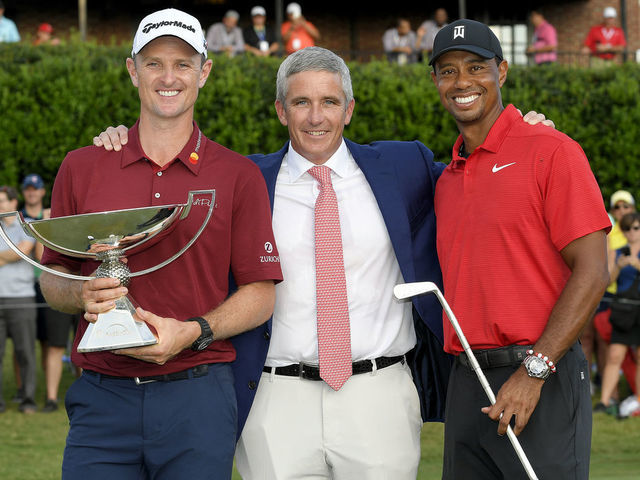 ATLANTA, GA - SEPTEMBER 23: PGA TOUR Commissioner Jay Monahan with Justin Rose of England, FedExCup winner and Tiger Woods, winner of the TOUR Championship after the final round of the TOUR Championship at East Lake Golf Club on September 23, 2018, in Atlanta, Georgia.