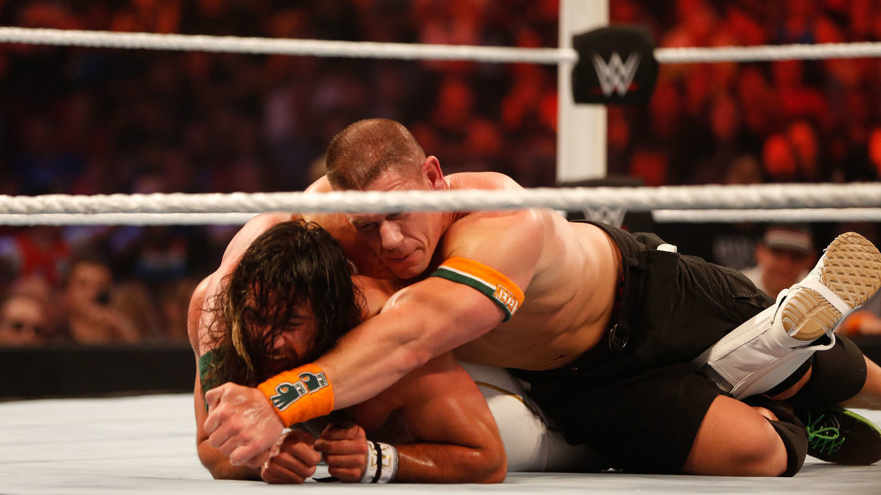 NEW YORK, NY - AUGUST 23: Seth Rollins and John Cena battle it out at the WWE SummerSlam 2015 at Barclays Center of Brooklyn on August 23, 2015 in New York City.