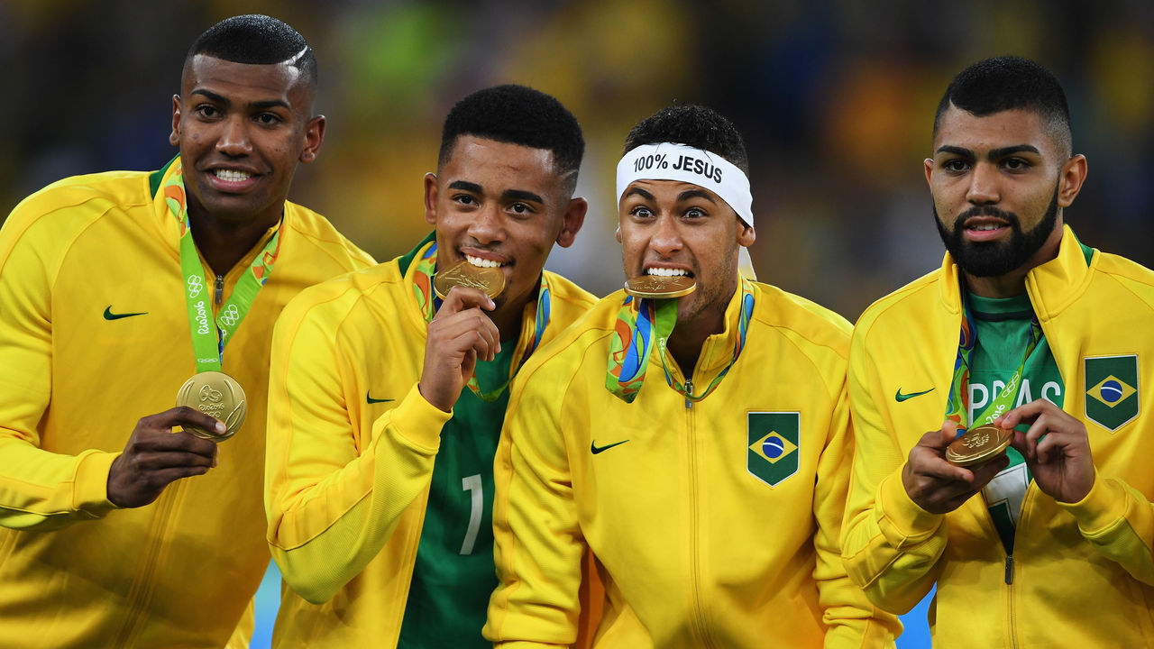 RIO DE JANEIRO, BRAZIL - AUGUST 20: Neymar of Brazil bites his medal after the Olympic Men's Final Football match between Brazil and Germany at Maracana Stadium on August 20, 2016 in Rio de Janeiro, Brazil.