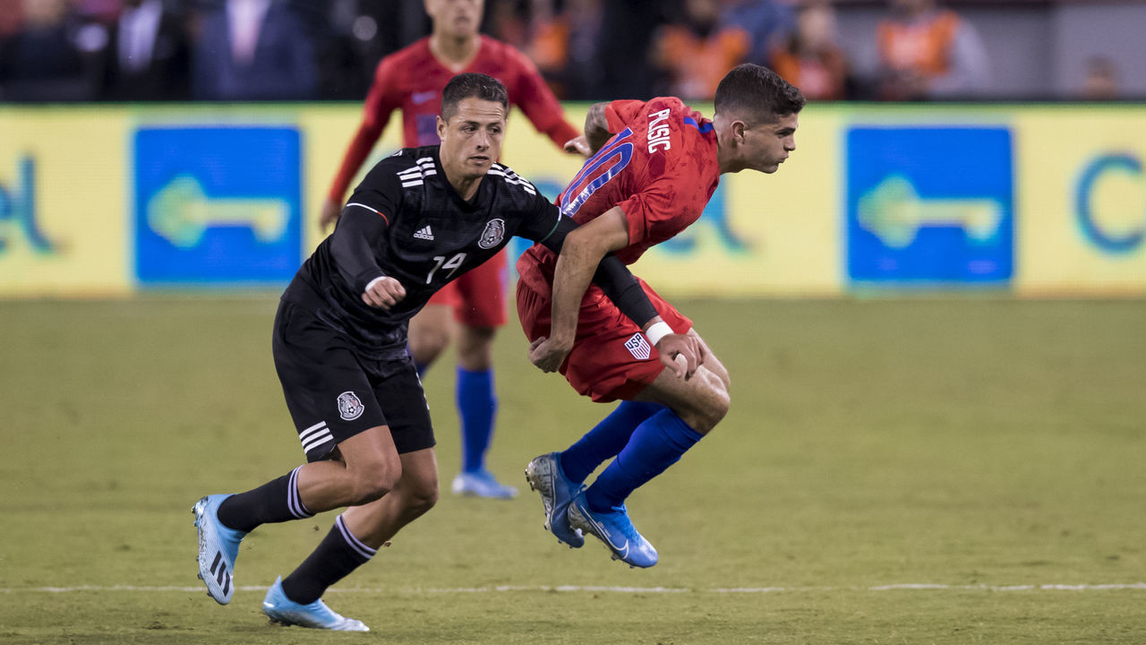 EAST RUTHERFORD, NJ - SEPTEMBER 06: Christian Pulisic #10 of the United States is guarded by Javier Hernadez #14 of Mexico during the 1st half of the Friendly match between the United States Men's National Team and Mexico. The match was held at MetLife Stadium on September 06, 2019 in East Rutherford, NJ USA. Mexico won the match with a score of 3 to 0.