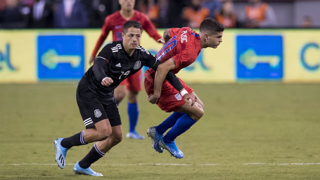 EAST RUTHERFORD, NJ - SEPTEMBER 06: Christian Pulisic #10 of the United States is guarded by Javier Hernadez #14 of Mexico during the 1st half of the Friendly match between the United States Men's National Team and Mexico. The match was held at MetLife Stadium on September 06, 2019 in East Rutherford, NJ USA. Mexico won the match with a score of 3 to 0.