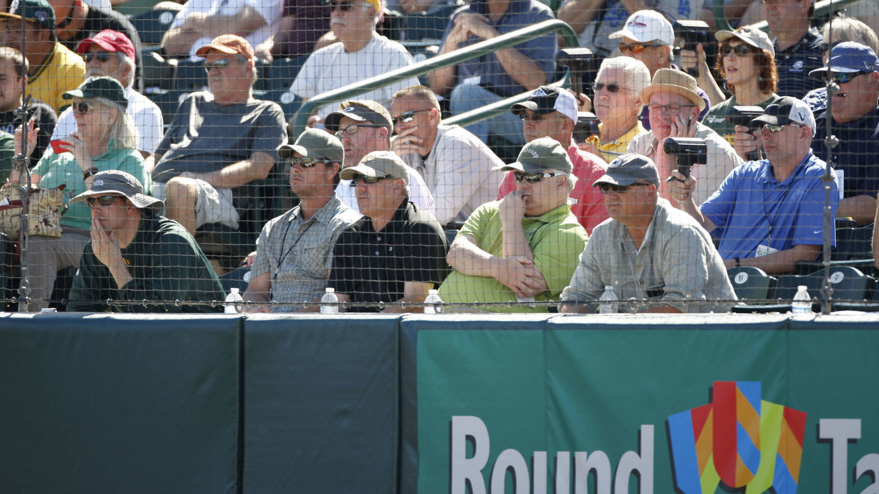 PHOENIX, AZ - MARCH 3: Scouts sit in the stands during the spring training game between the Oakland Athletics the Los Angeles Dodgers at Phoenix Municipal Stadium on March 3, 2014 in Phoenix, Arizona.