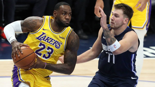 DALLAS, TEXAS - NOVEMBER 01: LeBron James #23 of the Los Angeles Lakers dribbles the ball against Luka Doncic #77 of the Dallas Mavericks in the first quarter at American Airlines Center on November 01, 2019 in Dallas, Texas.