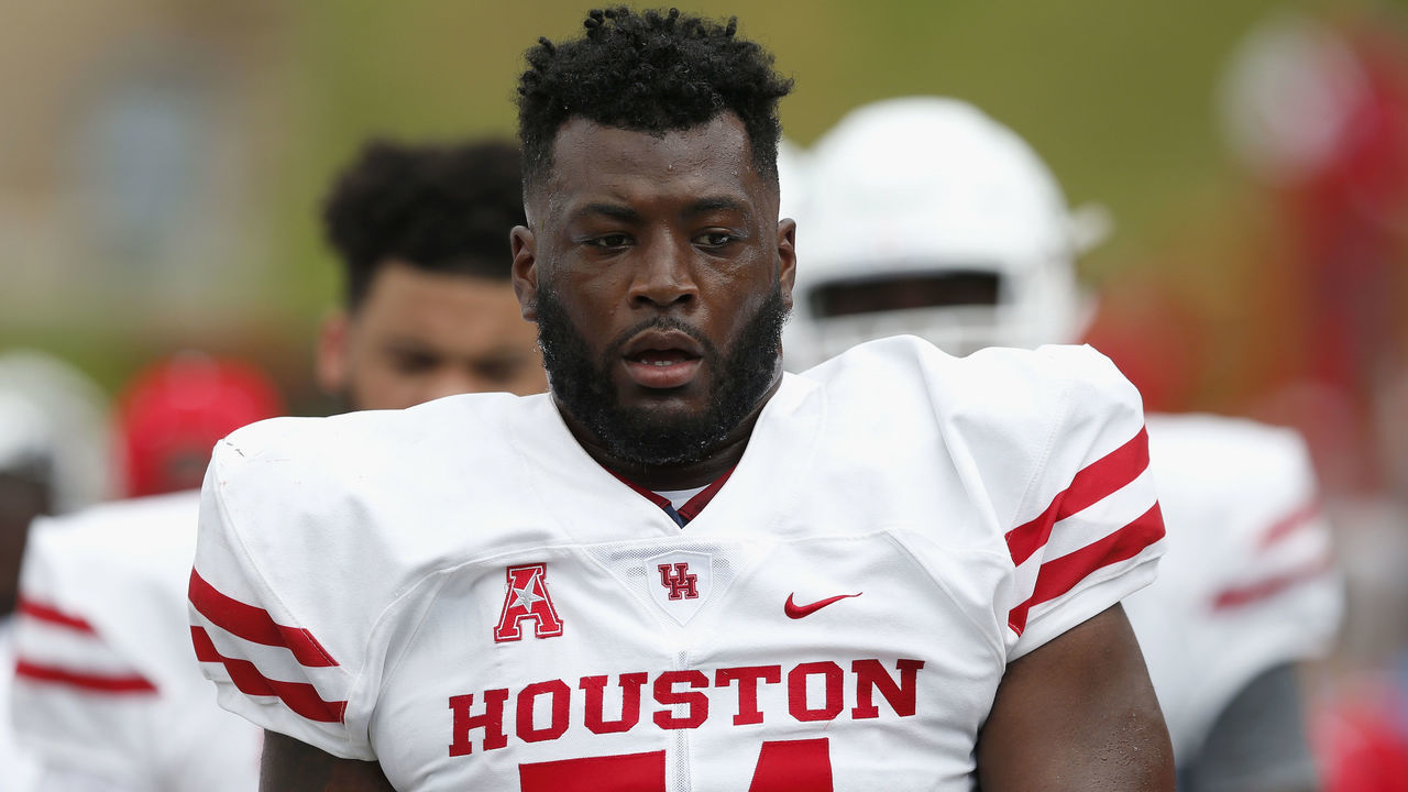 HOUSTON, TX - SEPTEMBER 01: Josh Jones #74 of the Houston Cougars stands on the sideline during the first half against the Rice Owls at Rice Stadium on September 1, 2018 in Houston, Texas.