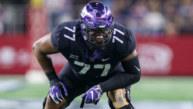 ARLINGTON, TX - SEPTEMBER 15: TCU Horned Frogs offensive tackle Lucas Niang (#77) prepares for the snap during the Advocare Showdown college football game between the Ohio State Buckeyes and the TCU Horned Frogs on September 15, 2018 at AT&T Stadium in Arlington, Texas. Ohio State won the game 40-28.