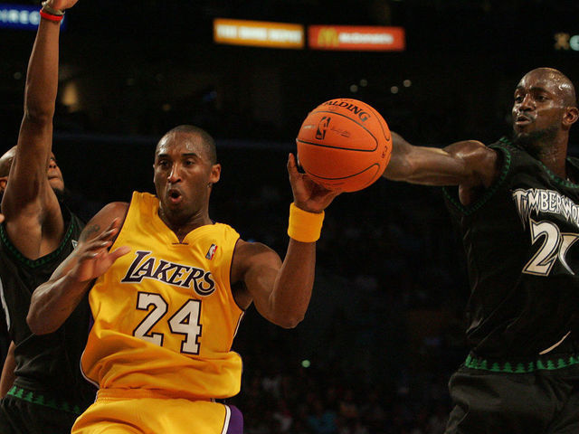 Los Angeles Lakers Kobe Bryant losses control of the ball after Minnesota Timberwolves Kevin Garnett,right, knocks ball away during first quarter action at Staples Center, Tuesday November 7, 2006.