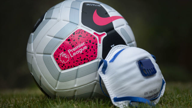 MANCHESTER, ENGLAND - APRIL 03: The official Nike Premier League match ball with a protective mask. The Coronavirus (COVID-19) pandemic has spread to many countries across the world, claiming over 40,000 lives and infecting hundreds of thousands more. on April 3, 2020 in Manchester, England