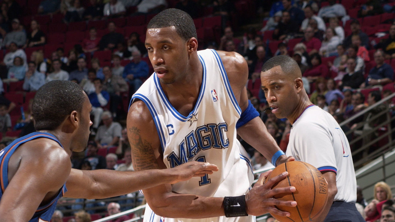 ORLANDO, FL - MARCH 10: Tracy McGrady #1 of the Orlando Magic is defended by Gilbert Arenas #0 of the Washington Wizards during the game at TD Waterhouse Centre on March 10, 2004 in Orlando, Florida. The Magic won 108-99. NOTE TO USER: User expressly acknowledges and agrees that, by downloading and/or using this Photograph, User is consenting to the terms and conditions of the Getty Images License Agreement.