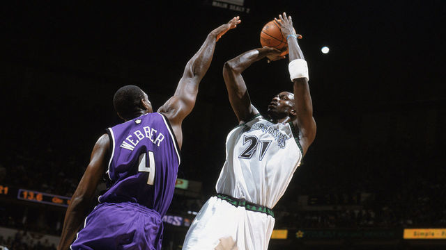 MINNEAPOLIS - MAY 19: Kevin Garnett #21 of the Minnesota Timberwolves puts a shot up against Chris Webber #4 of the Sacramento Kings in Game Seven of the Western Conference Semifinals during the 2004 NBA Playoffs at Target Center on May 19, 2004 in Minneapolis, Minnesota. The Timberwolves won 83-80. NOTE TO USER: User expressly acknowledges and agrees that, by downloading and/or using this Photograph, User is consenting to the terms and conditions of the Getty Images License Agreement.