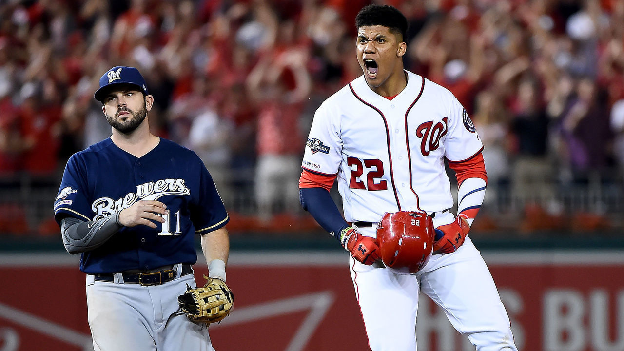 WASHINGTON, DC - OCTOBER 01: Juan Soto #22 of the Washington Nationals celebrates after hitting a single to right field to score 3 runs off of an error by Trent Grisham #2 of the Milwaukee Brewers during the eighth inning in the National League Wild Card game at Nationals Park on October 01, 2019 in Washington, DC.