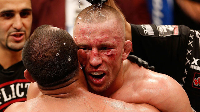 LAS VEGAS, NV - NOVEMBER 16: (R-L) Georges St-Pierre congratulates Johny Hendricks after their UFC welterweight championship bout during the UFC 167 event inside the MGM Grand Garden Arena on November 16, 2013 in Las Vegas, Nevada.