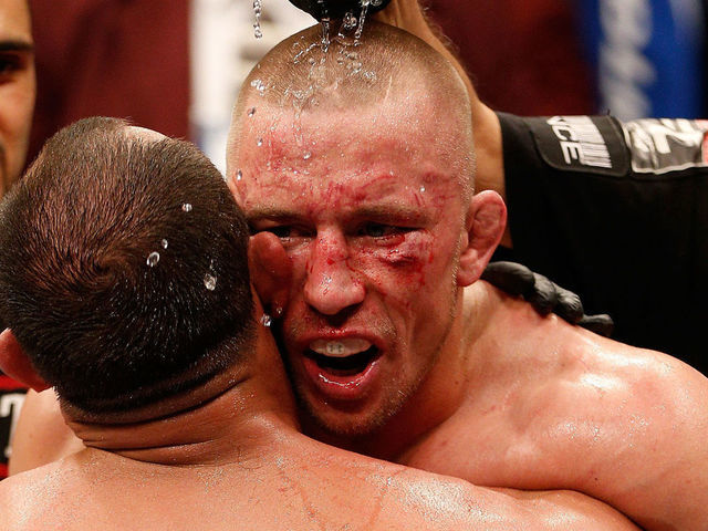 LAS VEGAS, NV - NOVEMBER 16: (R-L) Georges St-Pierre congratulates Johny Hendricks after their UFC welterweight championship bout during the UFC 167 event inside the MGM Grand Garden Arena on November 16, 2013 in Las Vegas, Nevada.