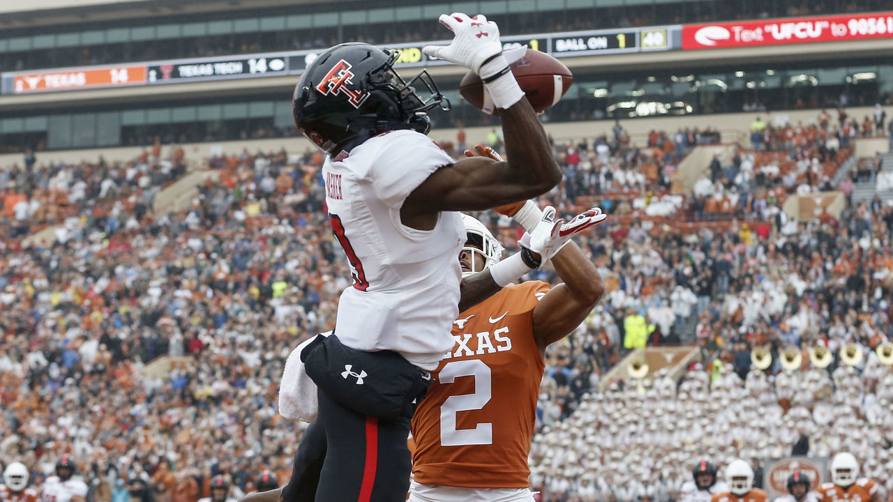 AUSTIN, TX - NOVEMBER 29: Kenyatta Watson II #2 of the Texas Longhorns breaks up a pass in the end zone intended for T.J. Vasher #9 of the Texas Tech Red Raiders in the second quarter at Darrell K Royal-Texas Memorial Stadium on November 29, 2019 in Austin, Texas.
