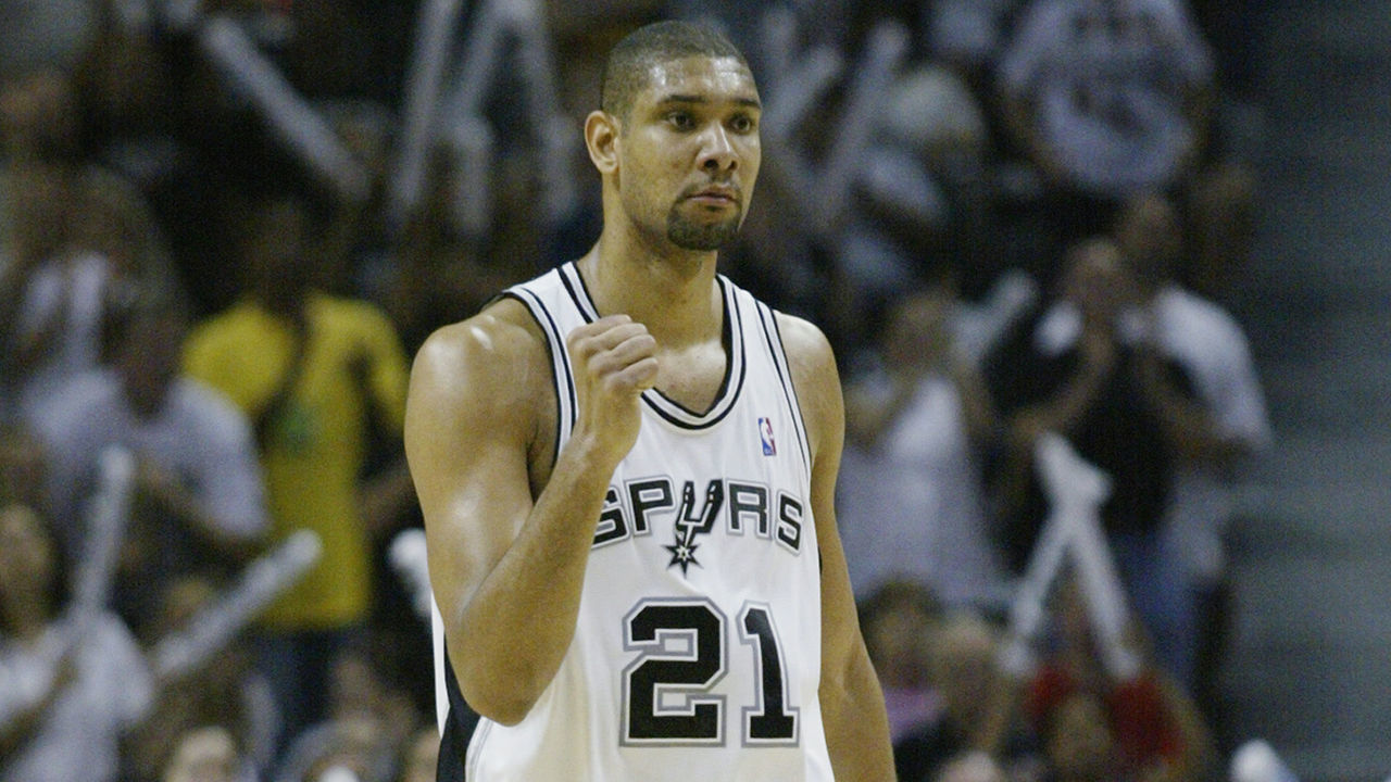 SAN ANTONIO, TX - JUNE 15: Tim Duncan #21 of the San Antonio Spurs celebrates in Game six of the 2003 NBA Finals against the New Jersey Nets on June 15, 2003 at the SBC Center in San Antonio, Texas. The Spurs won 88-77 and defeated the Nets to win the NBA Championship. NOTE TO USER: User expressly acknowledges and agrees that, by downloading and/or using this Photograph, User is consenting to the terms and conditions of the Getty Images License Agreement.