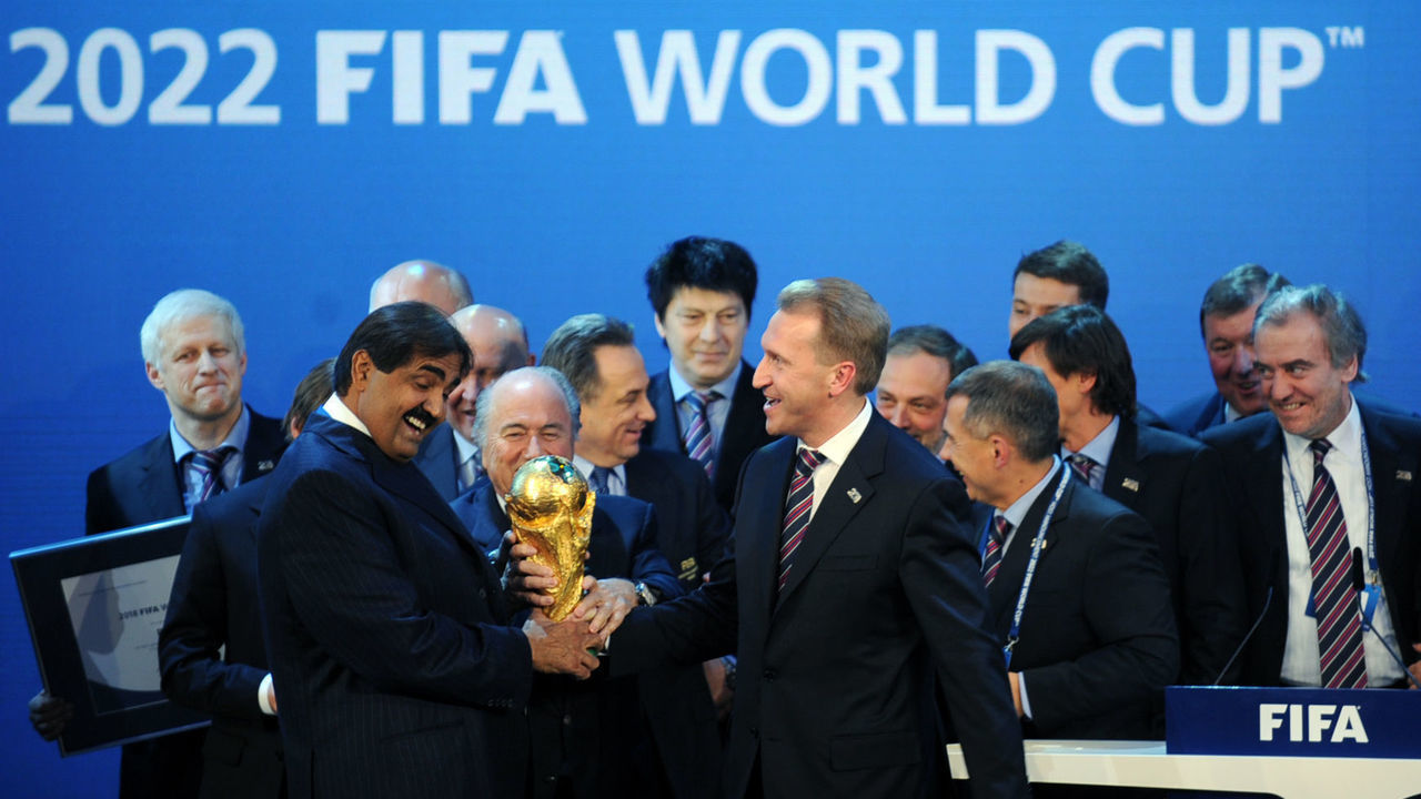 Emir of the State of Qatar Sheikh Hamad bin Khalifa Al-Thani (L), Fifa President Joseph Blatter (C) and Russia's Deputy Prime Minister Igor Shuvalov pose with the World Cup following the announcement that Russia and Qatar will host the 2018 and 2022 World Cups on December 2, 2010 at the FIFA headquarters in Zurich. AFP PHOTO / PHILIPPE DESMAZES