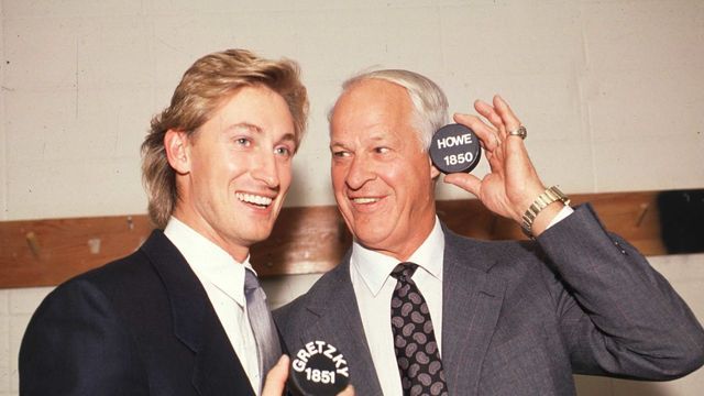 EDMONTON - OCTOBER 15: Wayne Gretzky of the Los Angeles Kings stands with Gordie Howe as they pose with the 1,851 puck that Gretkzy scored with to pass Howe as the all-time point leader in the NHL against the Edmonton Oilers on October 15, 1989 at Northlands Coliseum in Edmonton, Alberta, Canada.