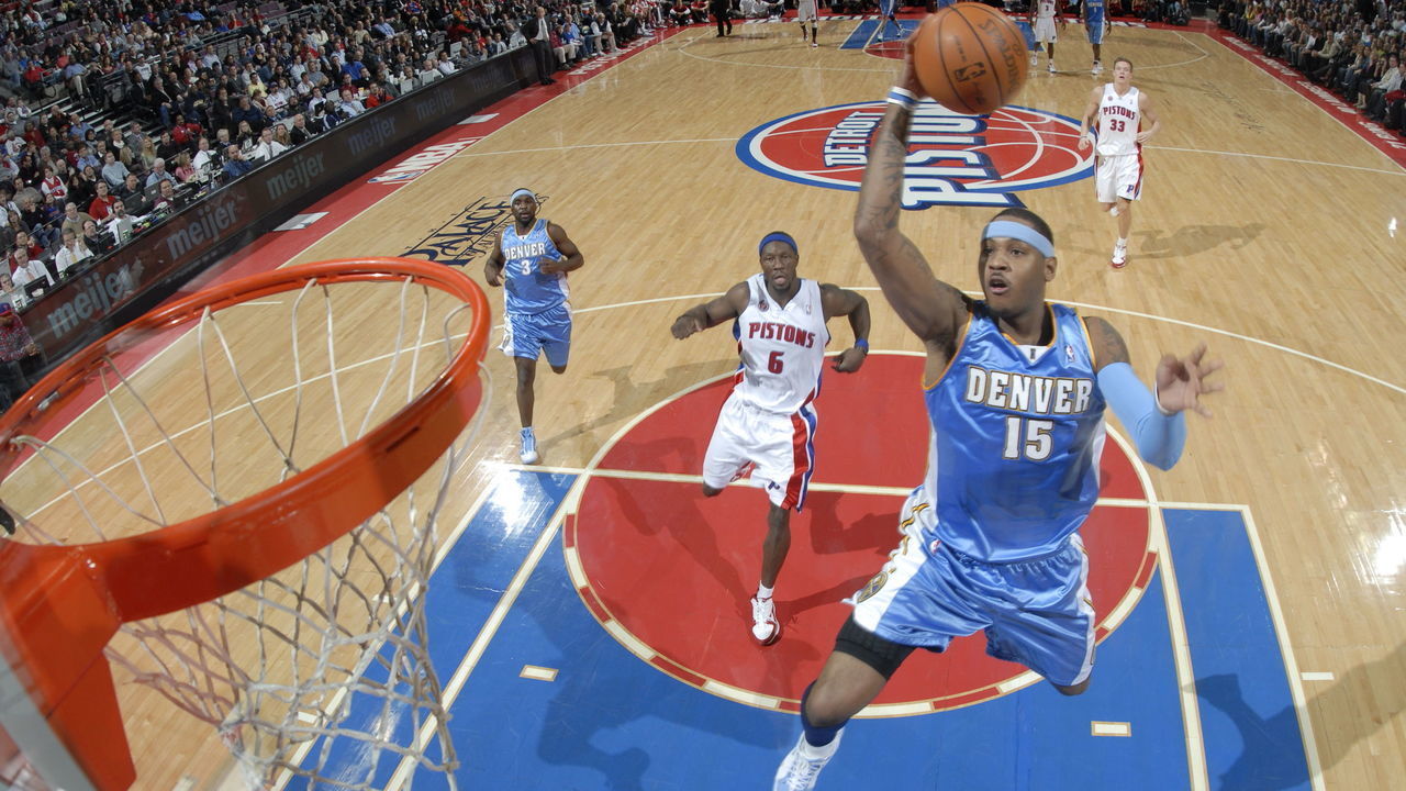 AUBURN HILLS, MI - DECEMBER 10: Carmelo Anthony #15 of the Denver Nuggets goes up for a break away shot past Ben Wallace #6 of the Detroit Pistons in a game at the Palace of Auburn Hills on December 10, 2009 in Auburn Hills, Michigan. NOTE TO USER: User expressly acknowledges and agrees that, by downloading and/or using this photograph, User is consenting to the terms and conditions of the Getty Images License Agreement. Mandatory Copyright Notice: Copyright 2009 NBAE