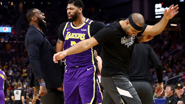 SAN FRANCISCO, CALIFORNIA - FEBRUARY 27: LeBron James #23, Anthony Davis #3 and Jared Dudley #10 of the Los Angeles Lakers react after Kyle Kuzma #0 dunked the ball during the second half of their game against the Golden State Warriors Chase Center on February 27, 2020 in San Francisco, California.