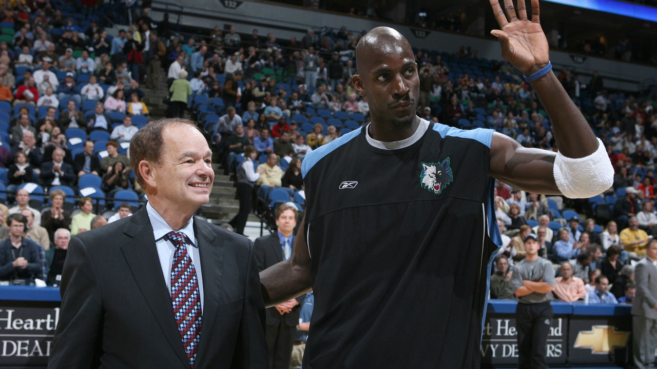 MINNEAPOLIS - NOVEMBER 09: Kevin Garnett #21 of the Minnesota Timberwolves receives an award from Glen Taylor for being a member of the 2004-05 all-defensive first team and the 2004-05 all-NBA second team prior to tonight's game against the Los Angeles Lakers on November 09, 2005 at the Target Center in Minneapolis, Minnesota. NOTE TO USER: User expressly acknowledges and agrees that, by downloading and /or using this Photograph, user is consenting to the terms and conditions of the Getty Images License Agreement: Mandatory Copyright Notice: Copyright 2005 NBAE