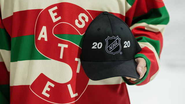 EVERETT, WA - DECEMBER 01: An Everett Silvertips fan wears a vintage Seattle Metropolitans jersey and holds an NHL Seattle hat before a game between the Kootenay Ice and the Everett Silvertips on Saturday, December 1, 2019 at Angel of the Winds Arena in Everett, WA.