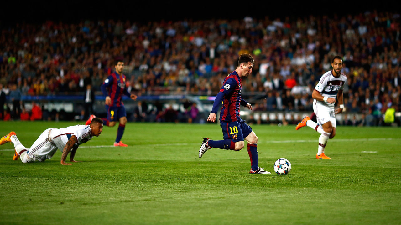 BARCELONA, SPAIN - MAY 06: Lionel Messi of Barcelona passes by Jerome Boateng of Bayern to score his second goal during the first leg of UEFA Champions League semifinal match between FC Barcelona and FC Bayern Muenchen at Camp Nou on May 6, 2015 in Barcelona, Spain.