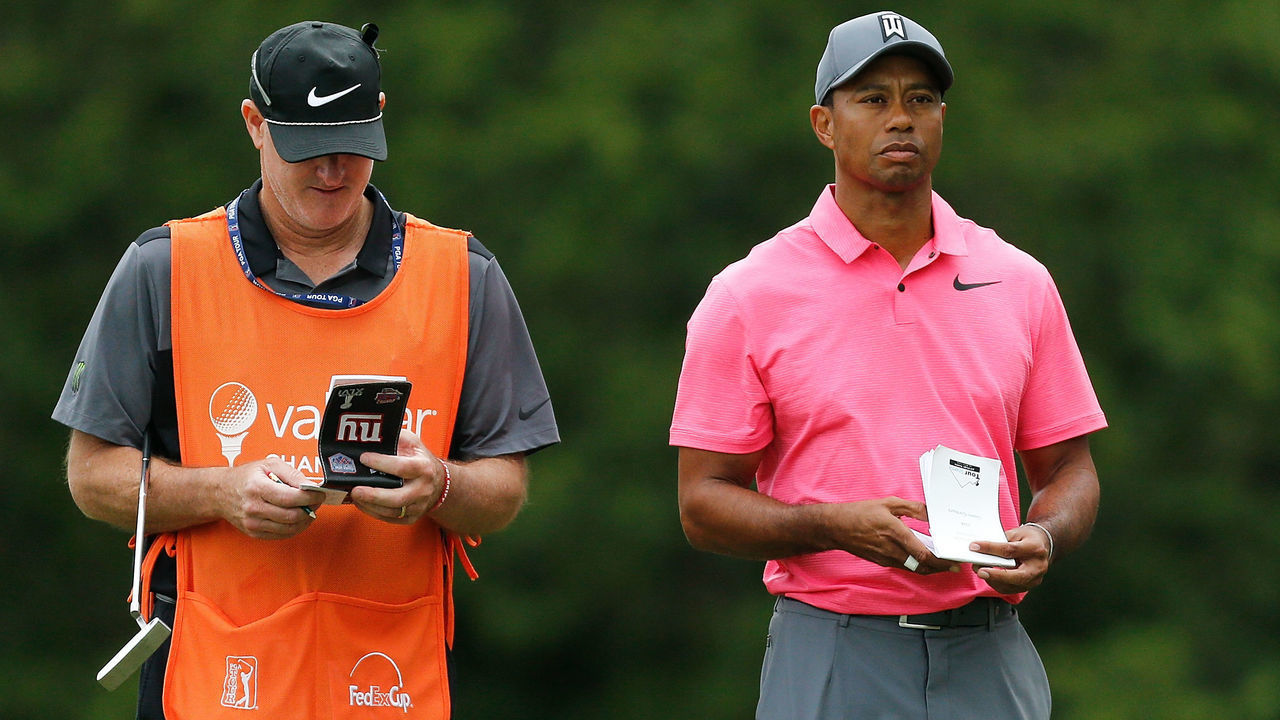 PALM HARBOR, FL - MARCH 10: Tiger Woods talks with his caddie on the 13th tee box during the third round of the Valspar Championship at Innisbrook Resort Copperhead Course on March 10, 2018 in Palm Harbor, Florida.